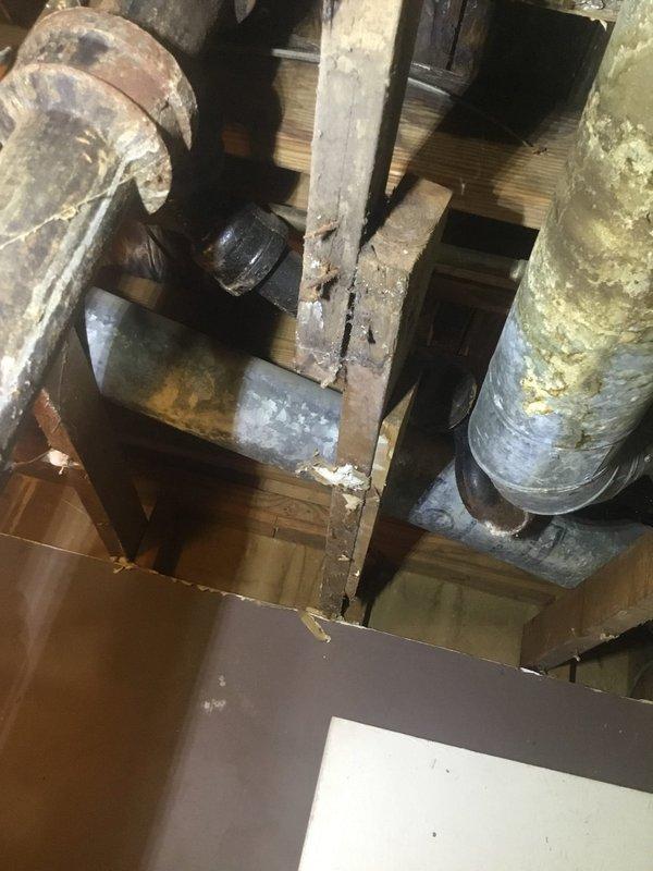 Norcross, GA - Identified water leak originating from shower plumbing in ceiling area. Inspected exposed basement/crawlspace to locate source, where examination revealed aging pipes with visible corrosion and moisture damage to surrounding wooden joists. Repaired compromised pipe connection to resolve the leak. Norcross, GA - Identified water leak originating from shower plumbing in ceiling area. Inspected exposed basement/crawlspace to locate source, where examination revealed aging pipes with visible corrosion and moisture damage to surrounding wooden joists. Repaired compromised pipe connection to resolve the leak.