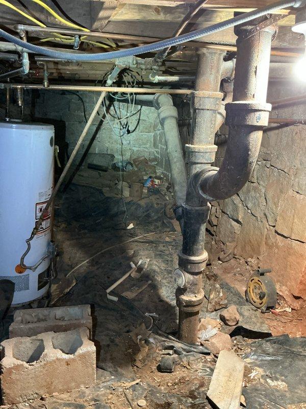 Completed estimate for electric water heater replacement in basement utility area. Inspection revealed aging unit with visible plumbing connections requiring attention. Noted deteriorated flooring near installation area and identified rusted pipe connections that would need addressing during replacement work. Completed estimate for electric water heater replacement in basement utility area. Inspection revealed aging unit with visible plumbing connections requiring attention. Noted deteriorated flooring near installation area and identified rusted pipe connections that would need addressing during replacement work.