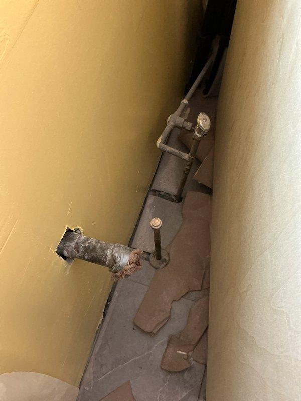 Completed estimate for electric water heater replacement in basement utility area. Inspection revealed aging unit with visible plumbing connections requiring attention. Noted deteriorated flooring near installation area and identified rusted pipe connections that would need addressing during replacement work. Completed estimate for electric water heater replacement in basement utility area. Inspection revealed aging unit with visible plumbing connections requiring attention. Noted deteriorated flooring near installation area and identified rusted pipe connections that would need addressing during replacement work.