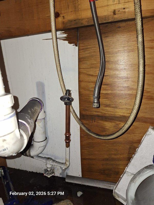 Identified and repaired a leak on a stop valve in a residential plumbing system. Replaced the faulty valve and verified proper operation of the water supply lines with no further leakage observed. Water staining on surrounding wooden surfaces was noted and customer was informed. Identified and repaired a leak on a stop valve in a residential plumbing system. Replaced the faulty valve and verified proper operation of the water supply lines with no further leakage observed. Water staining on surrounding wooden surfaces was noted and customer was informed.