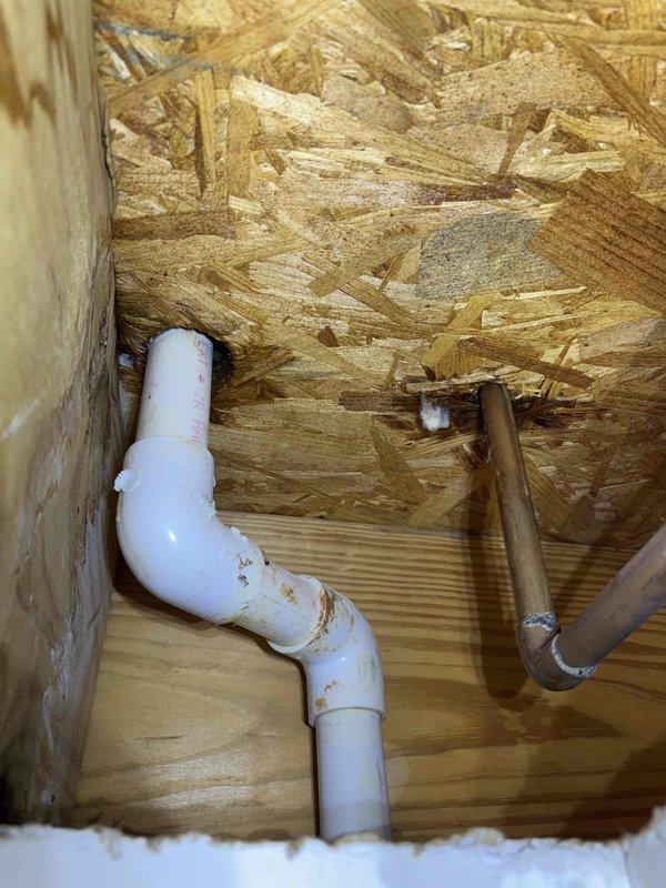 Identified and repaired a plumbing leak inside wall cavity near sink. Visual inspection revealed water damage on OSB backing. Performed hydrostatic pressure test post-repair, confirming system integrity with pressure holding between 80-100 PSI. Identified and repaired a plumbing leak inside wall cavity near sink. Visual inspection revealed water damage on OSB backing. Performed hydrostatic pressure test post-repair, confirming system integrity with pressure holding between 80-100 PSI.