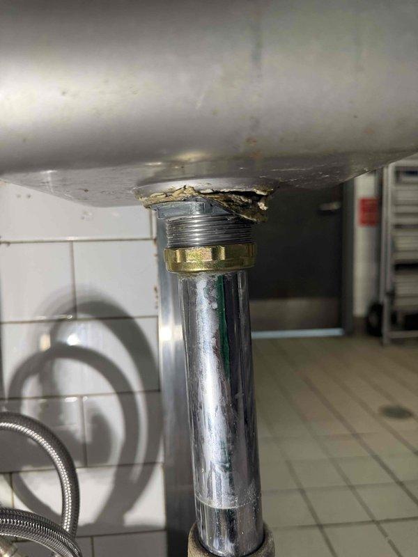 Cleared severely clogged drain pipe containing significant buildup of debris and metal fragments. Identified damaged sink connection with deteriorated material around pipe entry point, suggesting water damage or improper previous installation. Repaired leaking sink by replacing damaged fittings and ensuring proper seal at connection point. Cleared severely clogged drain pipe containing significant buildup of debris and metal fragments. Identified damaged sink connection with deteriorated material around pipe entry point, suggesting water damage or improper previous installation. Repaired leaking sink by replacing damaged fittings and ensuring proper seal at connection point.