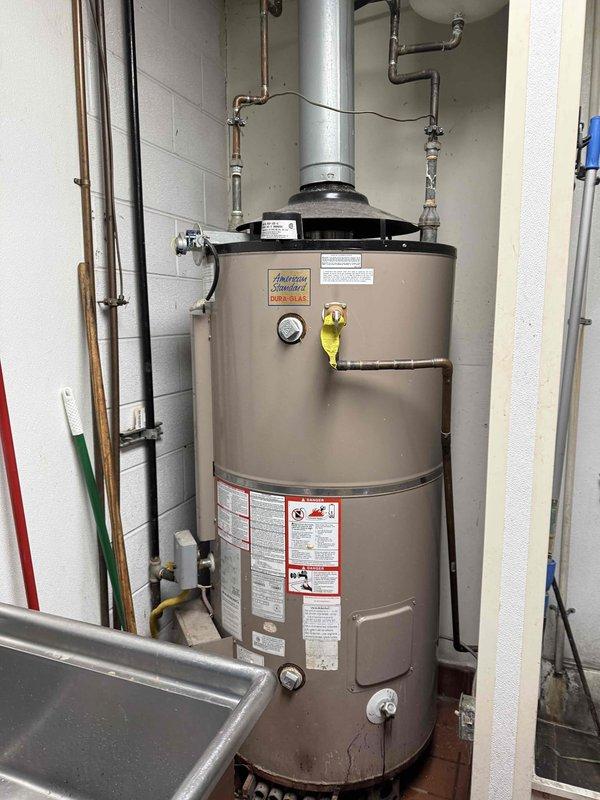 Inspected 100 gallon gas water heater reported to be leaking. Checked system pressure using WATTS gauge, which indicated approximately 50-60 PSI, within normal operating range. Identified leak source and repaired connections to resolve issue. Inspected 100 gallon gas water heater reported to be leaking. Checked system pressure using WATTS gauge, which indicated approximately 50-60 PSI, within normal operating range. Identified leak source and repaired connections to resolve issue.