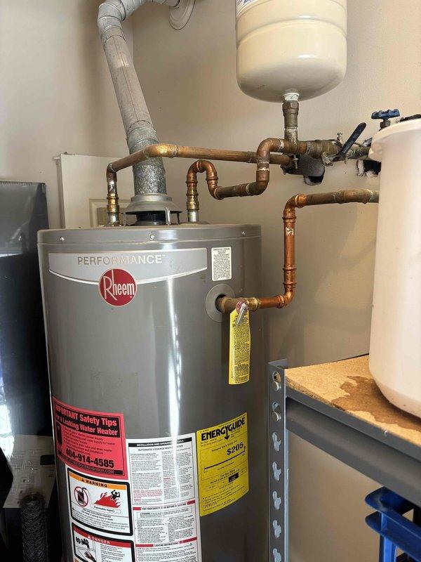 Responded to customer complaint of brown hot water from Rheem Performance standard water heater. Performed visual inspection of unit and plumbing system, noting copper pipes showing significant oxidation and sediment buildup. Flushed water heater tank to remove accumulated sediment causing discoloration, cleaned inlet screen, and verified proper operation of temperature/pressure relief valve. System now producing clear water with normal flow and temperature. Responded to customer complaint of brown hot water from Rheem Performance standard water heater. Performed visual inspection of unit and plumbing system, noting copper pipes showing significant oxidation and sediment buildup. Flushed water heater tank to remove accumulated sediment causing discoloration, cleaned inlet screen, and verified proper operation of temperature/pressure relief valve. System now producing clear water with normal flow and temperature.