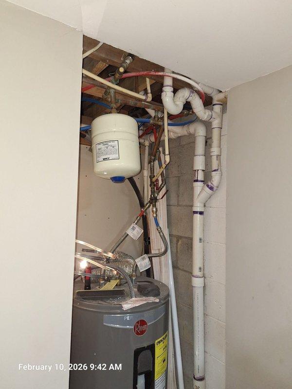 Identified water leak in laundry room ceiling originating from master bathroom above. Inspection revealed hydronic expansion tank with improper installation causing leak. Replaced expansion tank with new HYDRONIC model HFT, secured properly with metal straps, and verified all connections at copper pipe assembly and brass fittings. Tested system for proper operation and confirmed no further leakage. Identified water leak in laundry room ceiling originating from master bathroom above. Inspection revealed hydronic expansion tank with improper installation causing leak. Replaced expansion tank with new HYDRONIC model HFT, secured properly with metal straps, and verified all connections at copper pipe assembly and brass fittings. Tested system for proper operation and confirmed no further leakage.