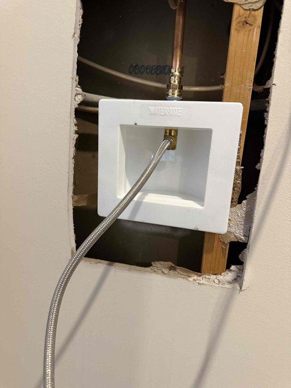 Replaced leaking refrigerator water supply valve in wall-mounted Waterite box. Removed section of drywall to access valve assembly and installed new braided stainless steel supply line. Verified system pressure at 70-80 PSI after repair and confirmed no leaks. Replaced leaking refrigerator water supply valve in wall-mounted Waterite box. Removed section of drywall to access valve assembly and installed new braided stainless steel supply line. Verified system pressure at 70-80 PSI after repair and confirmed no leaks.