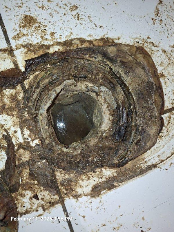 Responded to emergency call for main line stoppage with sewage backup in basement toilet. Visual inspection revealed severe clogging with significant waste buildup around the drain opening and deterioration of the pipe interior. Successfully cleared the blockage and restored proper drainage function. Responded to emergency call for main line stoppage with sewage backup in basement toilet. Visual inspection revealed severe clogging with significant waste buildup around the drain opening and deterioration of the pipe interior. Successfully cleared the blockage and restored proper drainage function.