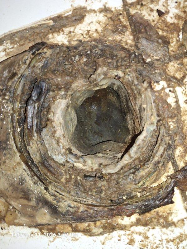 Responded to emergency call for main line stoppage with sewage backup in basement toilet. Visual inspection revealed severe clogging with significant waste buildup around the drain opening and deterioration of the pipe interior. Successfully cleared the blockage and restored proper drainage function. Responded to emergency call for main line stoppage with sewage backup in basement toilet. Visual inspection revealed severe clogging with significant waste buildup around the drain opening and deterioration of the pipe interior. Successfully cleared the blockage and restored proper drainage function.