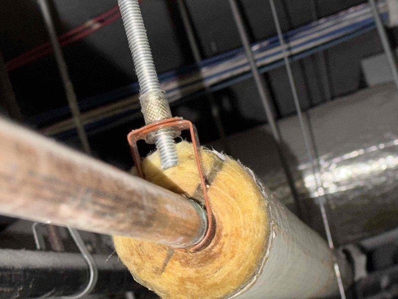 Inspected water heater system reporting leakage. Identified severely corroded copper supply line with visible blue-green oxidation and mineral deposits as source of leak. Found compromised pipe insulation with exposed fiberglass material in the mechanical space. Replacement of affected copper piping section recommended to prevent further water damage. Inspected water heater system reporting leakage. Identified severely corroded copper supply line with visible blue-green oxidation and mineral deposits as source of leak. Found compromised pipe insulation with exposed fiberglass material in the mechanical space. Replacement of affected copper piping section recommended to prevent further water damage.