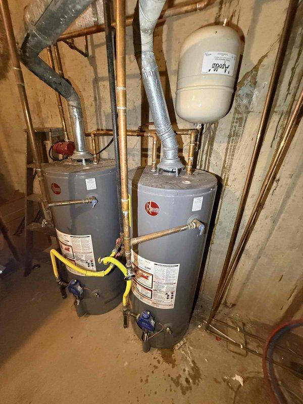 Inspected dual Rheem gas water heaters in basement utility area. Documented excessive system pressure reading of 120-130 psi (gauge maximum 200 psi). Evaluated feasibility of tankless conversion and investigated reported minor water leak affecting ceiling tile in downstairs bathroom, though no active leakage was observed at time of service. Inspected dual Rheem gas water heaters in basement utility area. Documented excessive system pressure reading of 120-130 psi (gauge maximum 200 psi). Evaluated feasibility of tankless conversion and investigated reported minor water leak affecting ceiling tile in downstairs bathroom, though no active leakage was observed at time of service.