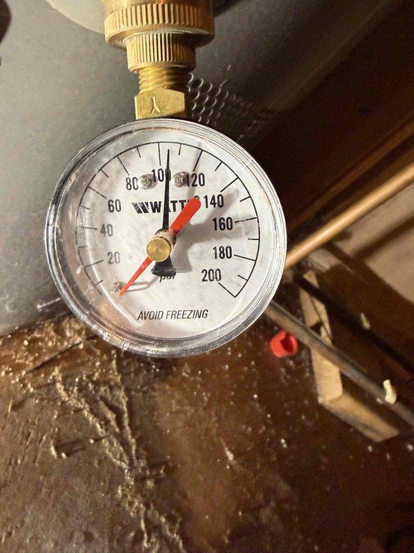 Inspected dual Rheem gas water heaters in basement utility area. Documented excessive system pressure reading of 120-130 psi (gauge maximum 200 psi). Evaluated feasibility of tankless conversion and investigated reported minor water leak affecting ceiling tile in downstairs bathroom, though no active leakage was observed at time of service. Inspected dual Rheem gas water heaters in basement utility area. Documented excessive system pressure reading of 120-130 psi (gauge maximum 200 psi). Evaluated feasibility of tankless conversion and investigated reported minor water leak affecting ceiling tile in downstairs bathroom, though no active leakage was observed at time of service.