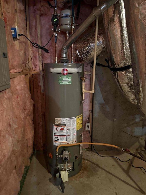 Inspected 8-9 year old water heater to evaluate replacement necessity. Observed standard residential unit with copper/PVC connections in utility area with proper electrical hookup. Noted discolored water with yellowish tint when testing flow at bathroom sink, indicating potential sediment buildup or mineral deposits affecting water quality. Inspected 8-9 year old water heater to evaluate replacement necessity. Observed standard residential unit with copper/PVC connections in utility area with proper electrical hookup. Noted discolored water with yellowish tint when testing flow at bathroom sink, indicating potential sediment buildup or mineral deposits affecting water quality.