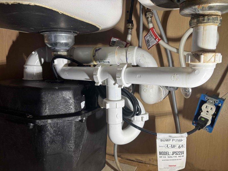 Responded to service call for sink odor issue. Inspected under-sink plumbing configuration, including P-trap assembly, garbage disposal unit, and associated drainage components. Examined bathroom ceiling access panel and surrounding plumbing fixtures. No trip charge applied as noted in service request. Responded to service call for sink odor issue. Inspected under-sink plumbing configuration, including P-trap assembly, garbage disposal unit, and associated drainage components. Examined bathroom ceiling access panel and surrounding plumbing fixtures. No trip charge applied as noted in service request.