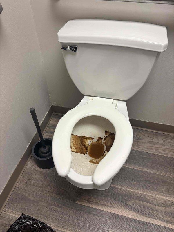 Responded to service call for clogged toilet in accessible bathroom with grab bars. Upon inspection, found significant waste material and brown staining inside bowl. Successfully cleared blockage using plumbing snake and verified proper flush operation before completing service. Responded to service call for clogged toilet in accessible bathroom with grab bars. Upon inspection, found significant waste material and brown staining inside bowl. Successfully cleared blockage using plumbing snake and verified proper flush operation before completing service.
