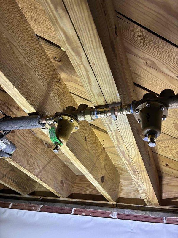 Inspected plumbing system in crawlspace area due to reported pressure issues. Examined copper pipe assembly with T-joints and ball valve that regulates water flow. Also inspected gas line system with brass fittings and valve/regulator to determine if related to pressure complaints. Inspected plumbing system in crawlspace area due to reported pressure issues. Examined copper pipe assembly with T-joints and ball valve that regulates water flow. Also inspected gas line system with brass fittings and valve/regulator to determine if related to pressure complaints.