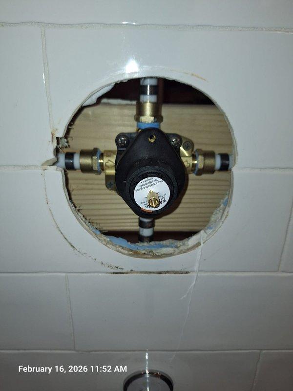 Successfully completed shower valve replacement as quoted. Removed existing deteriorated mixing valve from tiled wall access point and installed new brass mixing valve with proper PEX connections and waterproofing membrane around the opening. Successfully completed shower valve replacement as quoted. Removed existing deteriorated mixing valve from tiled wall access point and installed new brass mixing valve with proper PEX connections and waterproofing membrane around the opening.