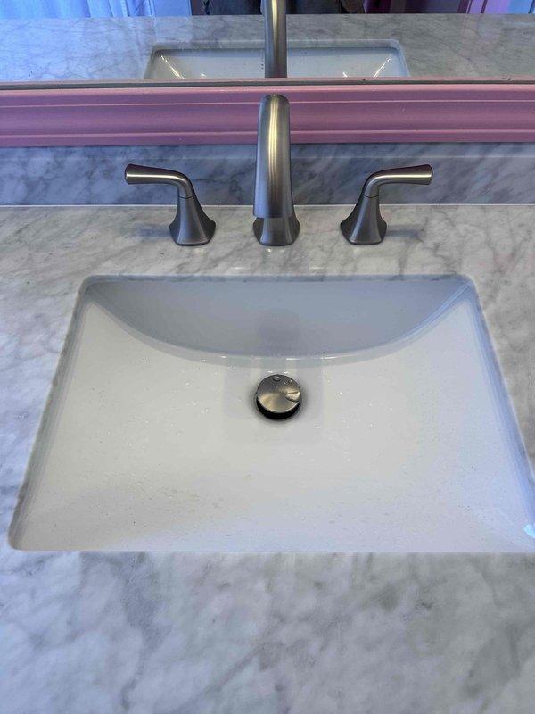 Successfully installed customer-supplied faucet in bathroom sink, securing it properly to the gray marble countertop and connecting all supply lines with leak-free connections. Completed installation of customer-supplied toilet and verified proper water flow and drainage in both the new fixtures and existing bathtub. Successfully installed customer-supplied faucet in bathroom sink, securing it properly to the gray marble countertop and connecting all supply lines with leak-free connections. Completed installation of customer-supplied toilet and verified proper water flow and drainage in both the new fixtures and existing bathtub.
