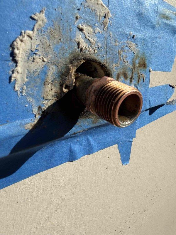 Diagnosed and repaired outdoor faucet leak caused by corroded copper pipe fitting with damaged waterproofing membrane. Replaced deteriorated pipe section and restored proper sealing around penetration point to eliminate continuous dripping that had persisted for approximately one week. Diagnosed and repaired outdoor faucet leak caused by corroded copper pipe fitting with damaged waterproofing membrane. Replaced deteriorated pipe section and restored proper sealing around penetration point to eliminate continuous dripping that had persisted for approximately one week.