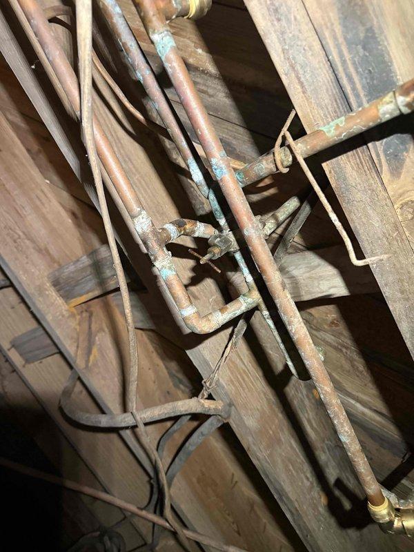 Responded to service call for bathroom plumbing issues where shower usage caused toilet to gurgle. Inspection of basement plumbing revealed significant corrosion on copper pipes with visible green oxidation at multiple connection points. Cleared main line clog that was causing cross-fixture backup, restoring proper drainage to both bathroom fixtures. Responded to service call for bathroom plumbing issues where shower usage caused toilet to gurgle. Inspection of basement plumbing revealed significant corrosion on copper pipes with visible green oxidation at multiple connection points. Cleared main line clog that was causing cross-fixture backup, restoring proper drainage to both bathroom fixtures.