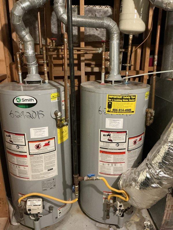 Doraville, GA - Inspected two side-by-side 40-gallon A.O. Smith gas water heaters installed in 2015. Confirmed units are functioning properly with no active leaks or operational issues. Customer is considering replacement options despite current satisfactory performance. Doraville, GA - Inspected two side-by-side 40-gallon A.O. Smith gas water heaters installed in 2015. Confirmed units are functioning properly with no active leaks or operational issues. Customer is considering replacement options despite current satisfactory performance.