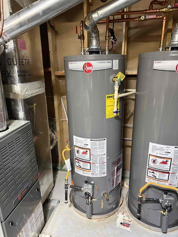 Installed 50-gallon Rheem water heater in utility room, replacing previous unit. Completed all necessary copper pipe connections, installed appropriate shutoff valves, and ensured proper ventilation with metal ductwork. System tested and confirmed operational with no leaks. Installed 50-gallon Rheem water heater in utility room, replacing previous unit. Completed all necessary copper pipe connections, installed appropriate shutoff valves, and ensured proper ventilation with metal ductwork. System tested and confirmed operational with no leaks.