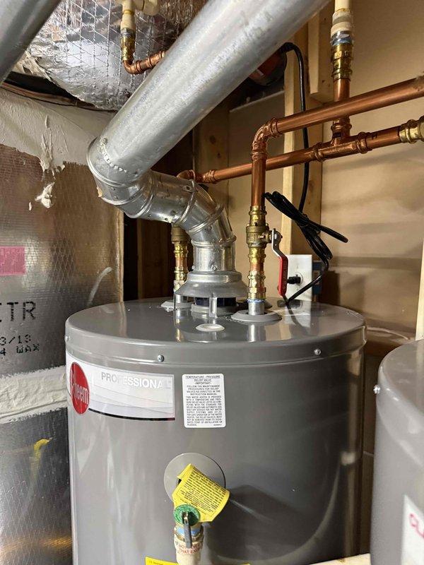 Installed 50-gallon Rheem water heater in utility room, replacing previous unit. Completed all necessary copper pipe connections, installed appropriate shutoff valves, and ensured proper ventilation with metal ductwork. System tested and confirmed operational with no leaks. Installed 50-gallon Rheem water heater in utility room, replacing previous unit. Completed all necessary copper pipe connections, installed appropriate shutoff valves, and ensured proper ventilation with metal ductwork. System tested and confirmed operational with no leaks.
