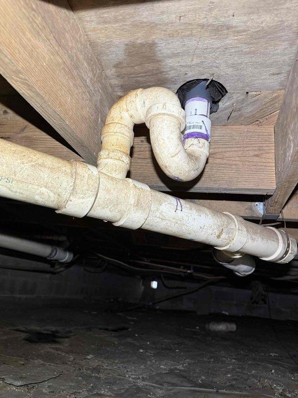 Completed estimate for replacement of aged cast iron plumbing system in crawl space. Inspection revealed corroded cast iron pipes with visible deterioration mounted along wooden joists. Recommended full cleanout and replacement with PVC piping system to prevent potential leaks and structural damage. Completed estimate for replacement of aged cast iron plumbing system in crawl space. Inspection revealed corroded cast iron pipes with visible deterioration mounted along wooden joists. Recommended full cleanout and replacement with PVC piping system to prevent potential leaks and structural damage.