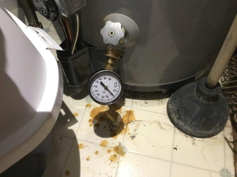 Doraville, GA - Replaced 30-year-old 40-gallon gas water heater that showed significant signs of failure including substantial rust/mineral deposits on floor tiles and active leakage around drain area. Installed new unit, pressure tested system to ensure proper operation, and verified all connections were secure with no leaks present. Doraville, GA - Replaced 30-year-old 40-gallon gas water heater that showed significant signs of failure including substantial rust/mineral deposits on floor tiles and active leakage around drain area. Installed new unit, pressure tested system to ensure proper operation, and verified all connections were secure with no leaks present.