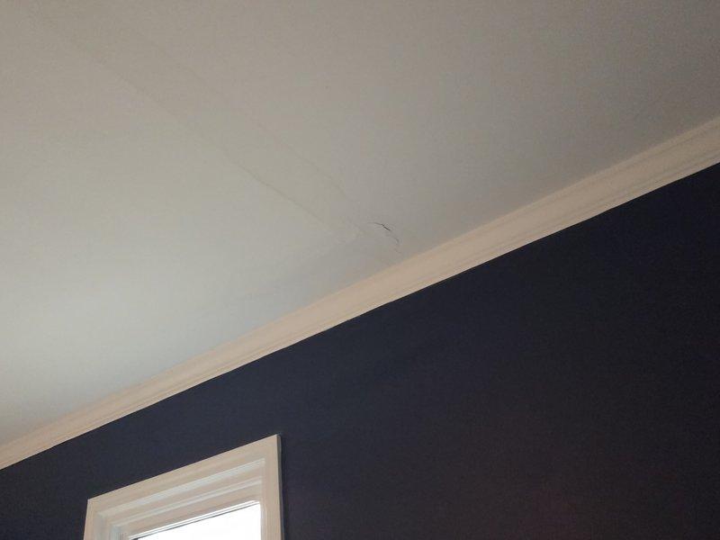 Located and identified water damage on interior wall and ceiling, evidenced by discoloration and staining on white wall surface and a visible crack along the ceiling corner. Completed repair of leaking plumbing fixture that was causing water to seep into the wall, preventing further structural damage to the affected areas. Located and identified water damage on interior wall and ceiling, evidenced by discoloration and staining on white wall surface and a visible crack along the ceiling corner. Completed repair of leaking plumbing fixture that was causing water to seep into the wall, preventing further structural damage to the affected areas.