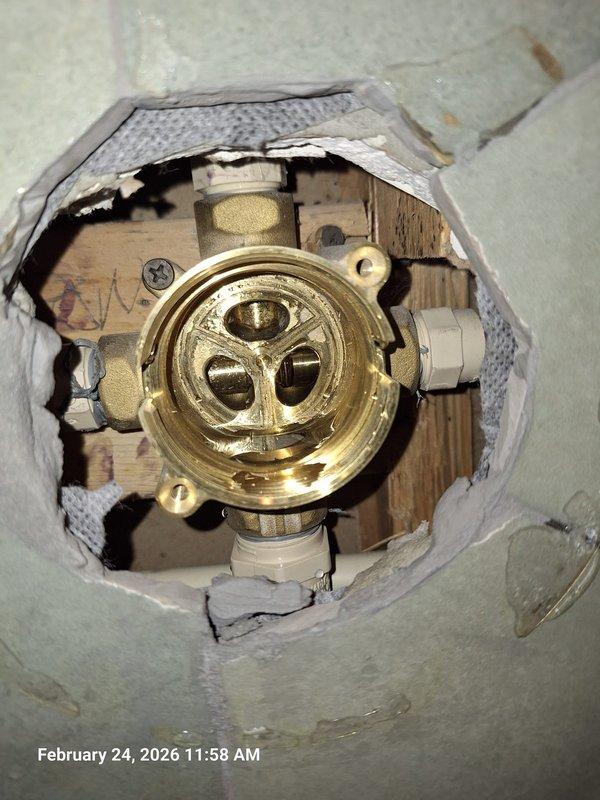 Completed scheduled follow-up to previous diagnostic work on Kohler shower multi-valve. Removed damaged valve assembly from tiled wall, which showed significant water damage and deterioration around the fixture. Installed replacement Kohler valve unit, securing all connections and verifying proper operation with no leaks. Completed scheduled follow-up to previous diagnostic work on Kohler shower multi-valve. Removed damaged valve assembly from tiled wall, which showed significant water damage and deterioration around the fixture. Installed replacement Kohler valve unit, securing all connections and verifying proper operation with no leaks.