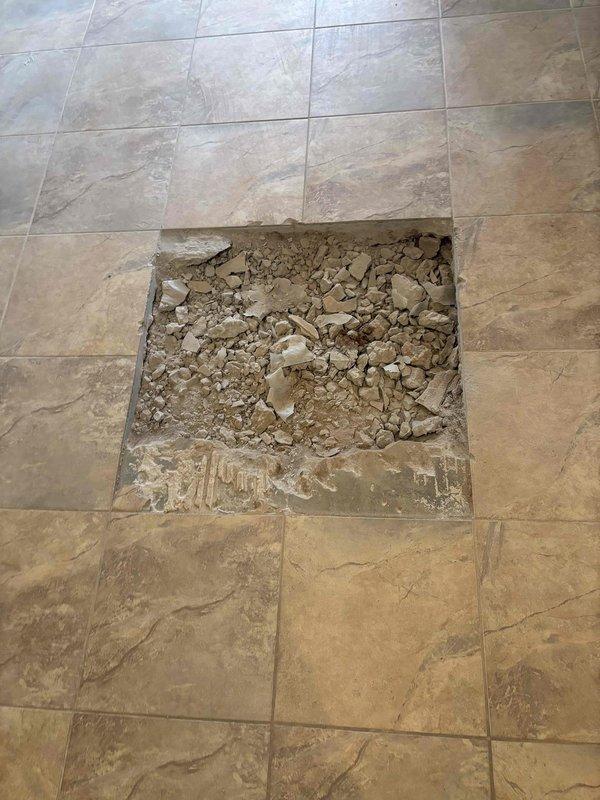 Completed drain repair service requiring excavation to access damaged PVC drainage pipe. Installed new pipe section with appropriate couplings and performed pressure testing to verify integrity. Additionally installed pressure reducing valve (PRV) as requested, and restored flooring by removing damaged tile to access underlying plumbing infrastructure. Completed drain repair service requiring excavation to access damaged PVC drainage pipe. Installed new pipe section with appropriate couplings and performed pressure testing to verify integrity. Additionally installed pressure reducing valve (PRV) as requested, and restored flooring by removing damaged tile to access underlying plumbing infrastructure.