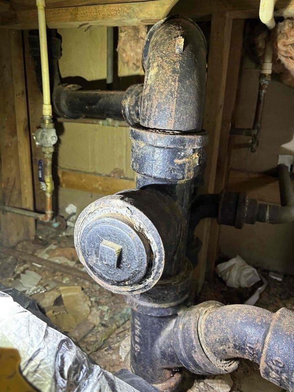 Diagnosed and cleared a clogged kitchen drain pipe causing slow drainage from both sink and dishwasher. Accessed the aging cast iron plumbing system via cleanout port in the P-trap configuration, removing accumulated debris that was restricting water flow. System now operating properly with normal drainage restored. Diagnosed and cleared a clogged kitchen drain pipe causing slow drainage from both sink and dishwasher. Accessed the aging cast iron plumbing system via cleanout port in the P-trap configuration, removing accumulated debris that was restricting water flow. System now operating properly with normal drainage restored.