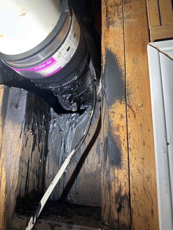 Investigated leak in basement ceiling, identified cast iron drainage pipe (KMDS-44) with significant leakage causing water damage to surrounding wooden structure. Observed substantial dark liquid seeping through ceiling and running down walls, with evidence of prolonged moisture exposure affecting both the wooden framing and drywall surfaces. Investigated leak in basement ceiling, identified cast iron drainage pipe (KMDS-44) with significant leakage causing water damage to surrounding wooden structure. Observed substantial dark liquid seeping through ceiling and running down walls, with evidence of prolonged moisture exposure affecting both the wooden framing and drywall surfaces.