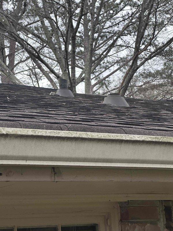 Conducted comprehensive inspection of HVAC ductwork system, documenting both interior and exterior components. Interior inspection revealed multiple metal ducts of varying sizes with visible insulated piping and flexible foil-wrapped connections. Exterior assessment identified two dome roof vents and examined gutter system condition, noting some weathering and fascia deterioration. Conducted comprehensive inspection of HVAC ductwork system, documenting both interior and exterior components. Interior inspection revealed multiple metal ducts of varying sizes with visible insulated piping and flexible foil-wrapped connections. Exterior assessment identified two dome roof vents and examined gutter system condition, noting some weathering and fascia deterioration.