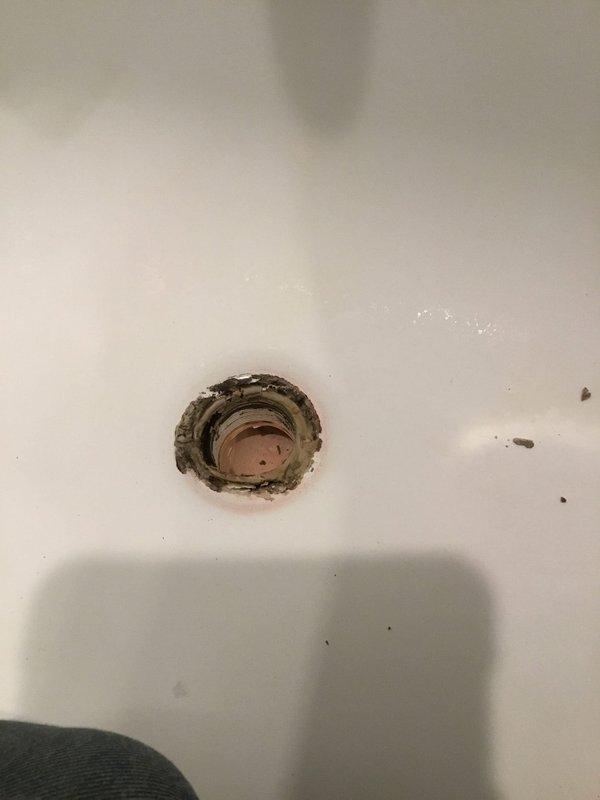 Conducted inspection of kitchen ceiling leak. Identified corroded drain fixtures in bathroom fixture above kitchen as source of leak. Observed significant deterioration, mineral buildup, and rusting around drain openings that were allowing water to seep through to ceiling below. Conducted inspection of kitchen ceiling leak. Identified corroded drain fixtures in bathroom fixture above kitchen as source of leak. Observed significant deterioration, mineral buildup, and rusting around drain openings that were allowing water to seep through to ceiling below.