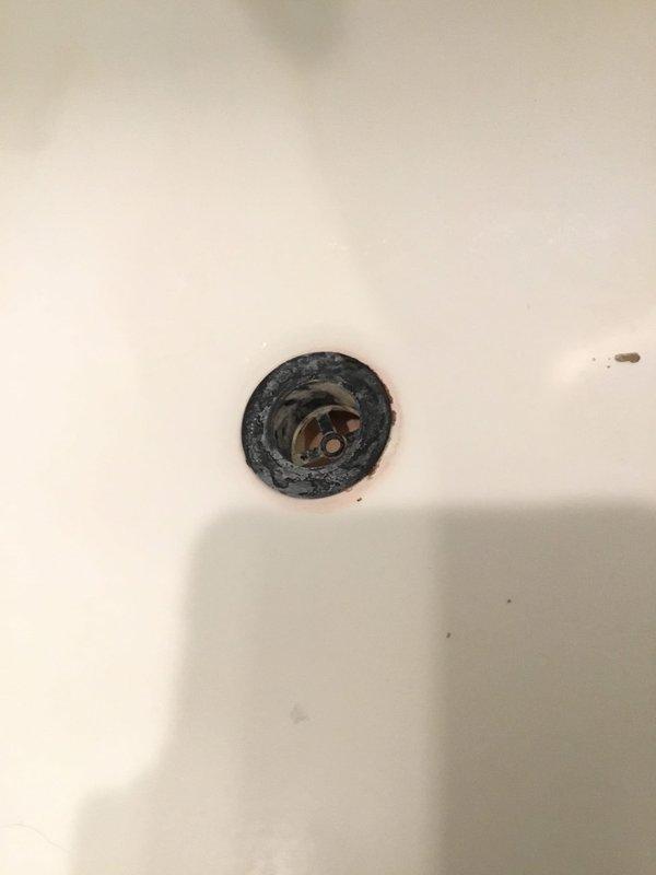 Conducted inspection of kitchen ceiling leak. Identified corroded drain fixtures in bathroom fixture above kitchen as source of leak. Observed significant deterioration, mineral buildup, and rusting around drain openings that were allowing water to seep through to ceiling below. Conducted inspection of kitchen ceiling leak. Identified corroded drain fixtures in bathroom fixture above kitchen as source of leak. Observed significant deterioration, mineral buildup, and rusting around drain openings that were allowing water to seep through to ceiling below.