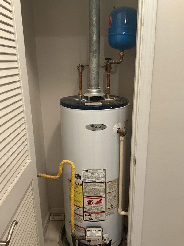 Conducted on-site assessment of existing Whirlpool water heater for potential replacement. Inspected current installation including copper supply lines, gas connection, flue venting, and expansion tank. Photos documented the plumbing infrastructure and current unit configuration to prepare comprehensive replacement estimate. Conducted on-site assessment of existing Whirlpool water heater for potential replacement. Inspected current installation including copper supply lines, gas connection, flue venting, and expansion tank. Photos documented the plumbing infrastructure and current unit configuration to prepare comprehensive replacement estimate.