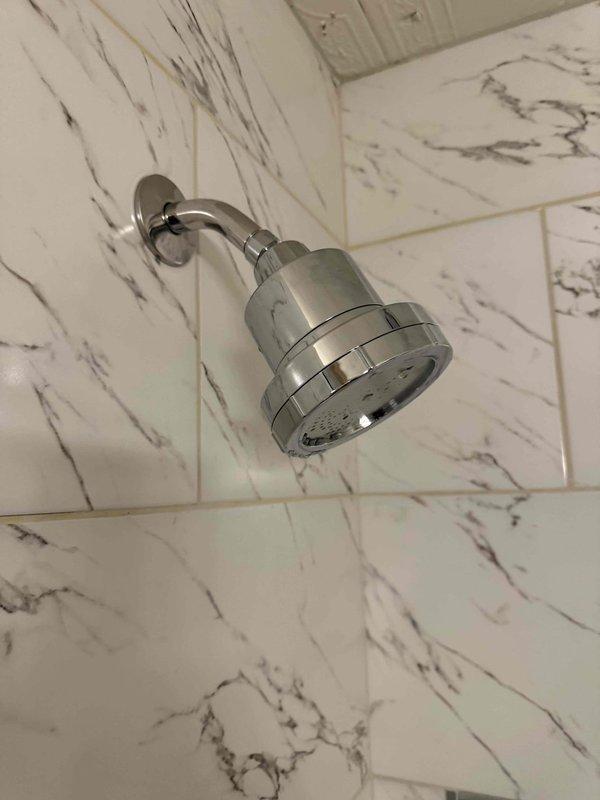 Responded to initial service call for multiple plumbing issues. Installed new chrome shower head with proper mounting and sealing to marble-tiled wall. Diagnosed kitchen sink leak and cleared drain. Repaired malfunctioning toilet to restore proper flushing operation. Documented completed work with photos of installations. Responded to initial service call for multiple plumbing issues. Installed new chrome shower head with proper mounting and sealing to marble-tiled wall. Diagnosed kitchen sink leak and cleared drain. Repaired malfunctioning toilet to restore proper flushing operation. Documented completed work with photos of installations.