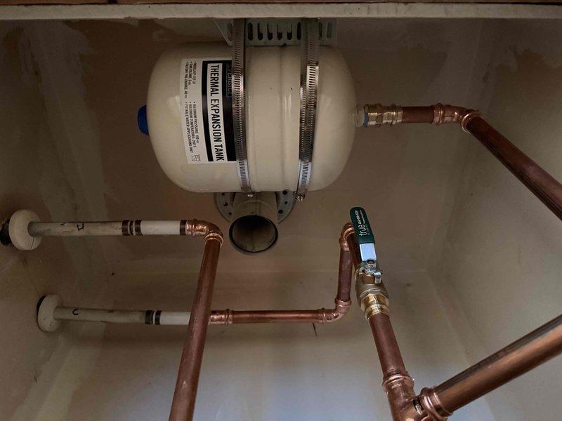 Installed new water heater system including properly connected PVC supply lines with copper fittings and a thermal expansion tank. Completed all necessary plumbing connections with appropriate shutoff valves and ensured the cold water line was properly marked for identification. Installed new water heater system including properly connected PVC supply lines with copper fittings and a thermal expansion tank. Completed all necessary plumbing connections with appropriate shutoff valves and ensured the cold water line was properly marked for identification.