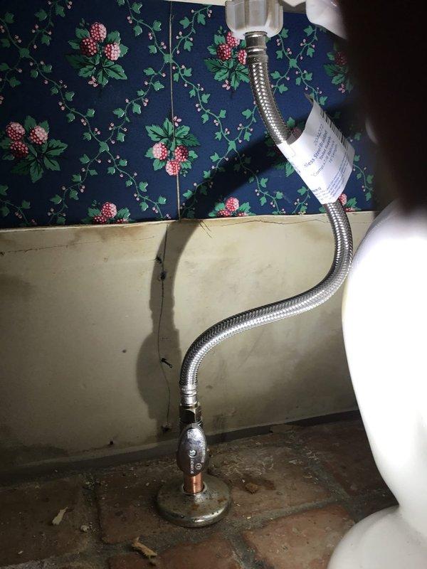 Diagnosed and repaired toilet leak by testing water pressure (reading approximately 100-120 PSI) and replacing damaged braided stainless steel supply line. Confirmed proper connection at shut-off valve and verified no further leakage after repair. Diagnosed and repaired toilet leak by testing water pressure (reading approximately 100-120 PSI) and replacing damaged braided stainless steel supply line. Confirmed proper connection at shut-off valve and verified no further leakage after repair.