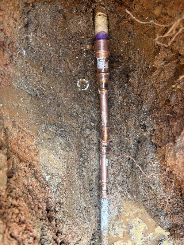 Repaired water leak in customer's yard by excavating around the affected area where water was pooling. Located a damaged section of copper water supply line that connected to PVC piping, which matched the location of previous repair work. Replaced the compromised pipe section and installed a new shutoff valve, then confirmed proper function with no further leakage. Repaired water leak in customer's yard by excavating around the affected area where water was pooling. Located a damaged section of copper water supply line that connected to PVC piping, which matched the location of previous repair work. Replaced the compromised pipe section and installed a new shutoff valve, then confirmed proper function with no further leakage.