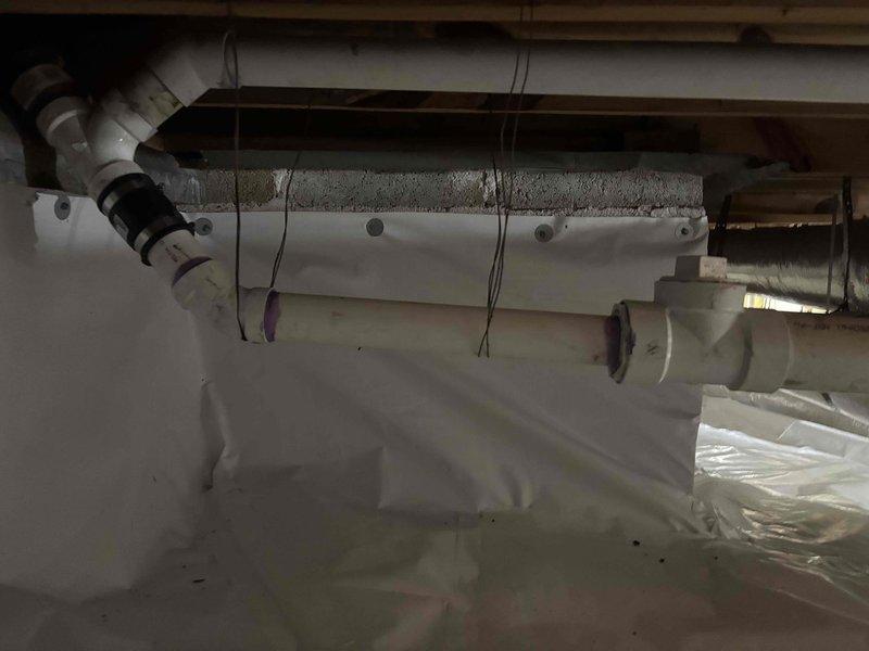 Responded to service call for slow kitchen sink drainage and sump pump issues. Inspection revealed mineral deposits and corrosion on basement drainage pipes, particularly at PVC elbow joints. Successfully cleared blockage and restored proper drainage function throughout the system. Responded to service call for slow kitchen sink drainage and sump pump issues. Inspection revealed mineral deposits and corrosion on basement drainage pipes, particularly at PVC elbow joints. Successfully cleared blockage and restored proper drainage function throughout the system.