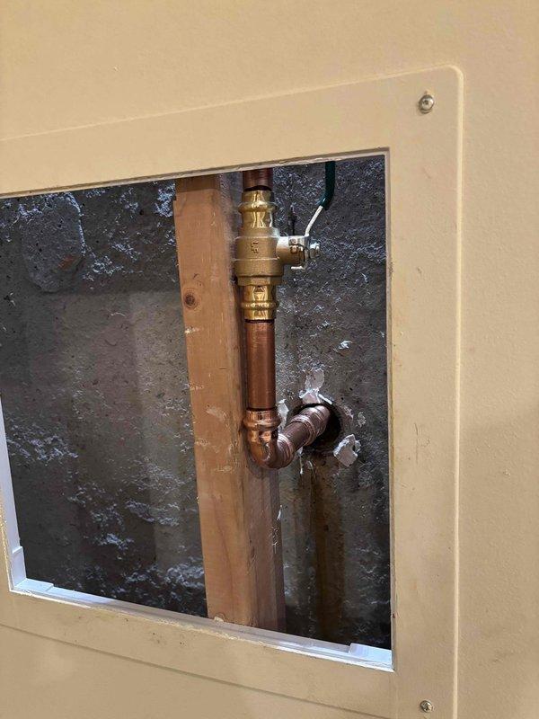 Responded to service call for a leak at the main shut-off valve when in closed position. Replaced water supply line and documented the condition of the valve assembly with photos showing the copper pipe configuration in the access panel. Customer was informed that replacement would be warranty-covered if valve was previously installed by our company, otherwise standard charges would apply for original valve replacement. Responded to service call for a leak at the main shut-off valve when in closed position. Replaced water supply line and documented the condition of the valve assembly with photos showing the copper pipe configuration in the access panel. Customer was informed that replacement would be warranty-covered if valve was previously installed by our company, otherwise standard charges would apply for original valve replacement.