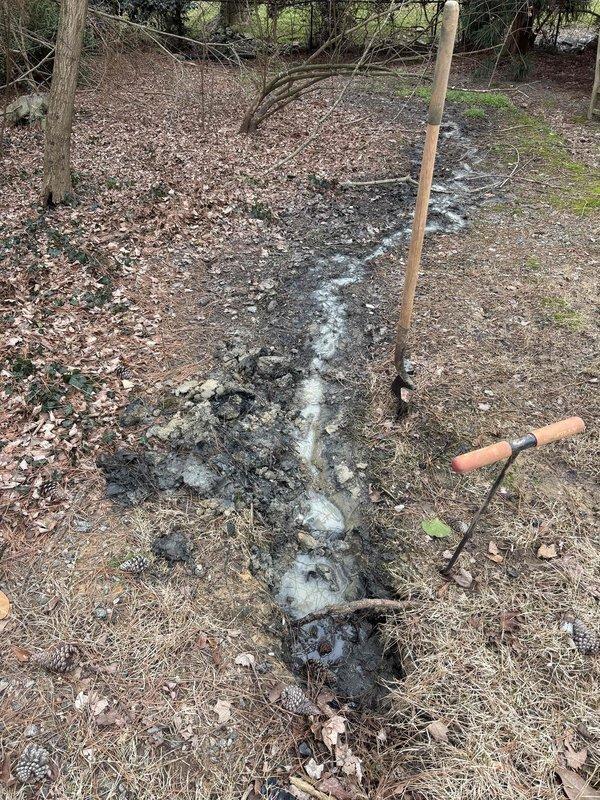 Responded to service call for toilet leaking into garage below. Excavated drainage channel to divert water away from structure and prevent future leakage. Confirmed successful resolution of the leak as reported by customer. Responded to service call for toilet leaking into garage below. Excavated drainage channel to divert water away from structure and prevent future leakage. Confirmed successful resolution of the leak as reported by customer.