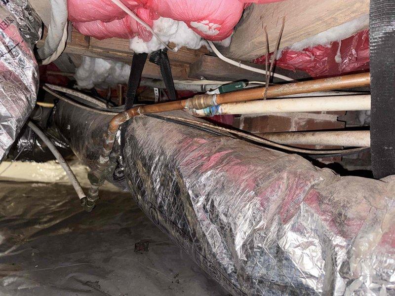 Responded to service call for water heater slow leak. Inspection revealed damaged insulation in crawlspace with visible moisture damage on surrounding brick wall. Identified corroded supply pipe as source of leak and repaired affected section. Responded to service call for water heater slow leak. Inspection revealed damaged insulation in crawlspace with visible moisture damage on surrounding brick wall. Identified corroded supply pipe as source of leak and repaired affected section.