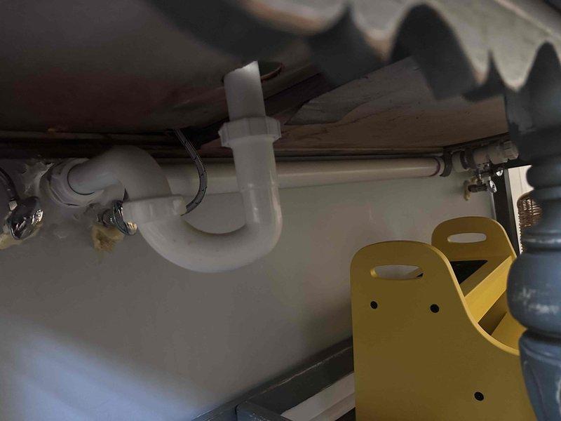 Responded to service call for slow drains and sewage odor in crawlspace. Inspected bathroom plumbing system including P-trap configuration and associated PVC drain pipes. Identified and cleared blockage in drain line that was causing backup and sewer gas intrusion, restoring proper drainage function and eliminating odor issue. Responded to service call for slow drains and sewage odor in crawlspace. Inspected bathroom plumbing system including P-trap configuration and associated PVC drain pipes. Identified and cleared blockage in drain line that was causing backup and sewer gas intrusion, restoring proper drainage function and eliminating odor issue.