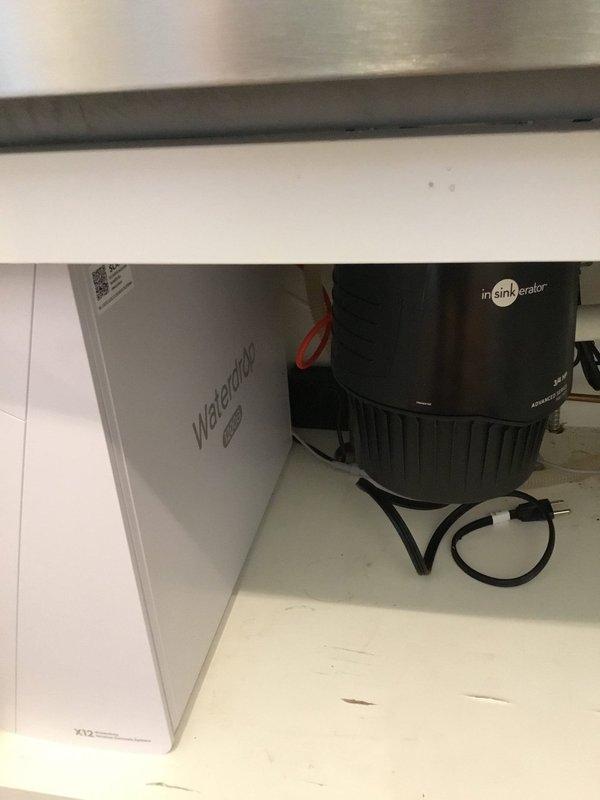 Brookhaven, GA - Installed customer-supplied reverse osmosis water filtration system per approved quote. Completed installation of WaterLogic filtration unit adjacent to existing InSinkErator garbage disposal under kitchen sink. Documented installation with verification photos showing proper positioning and connections of all components. Brookhaven, GA - Installed customer-supplied reverse osmosis water filtration system per approved quote. Completed installation of WaterLogic filtration unit adjacent to existing InSinkErator garbage disposal under kitchen sink. Documented installation with verification photos showing proper positioning and connections of all components.