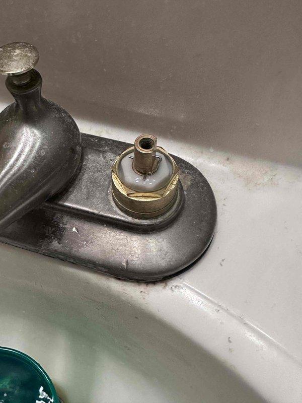 Responded to service call for kitchen faucet leak. Upon inspection, identified a deteriorated valve washer in the aged bathroom sink faucet with brushed nickel/bronze finish. Replaced worn washer and tested fixture functionality, confirming successful repair with no further leakage. Responded to service call for kitchen faucet leak. Upon inspection, identified a deteriorated valve washer in the aged bathroom sink faucet with brushed nickel/bronze finish. Replaced worn washer and tested fixture functionality, confirming successful repair with no further leakage.