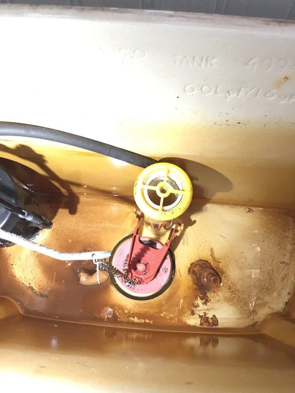 Diagnosed and repaired toilet tank with significant water discoloration and mineral buildup. Removed and replaced faulty valve mechanism, which was causing persistent leaking issues in both the tank and shower system. Diagnosed and repaired toilet tank with significant water discoloration and mineral buildup. Removed and replaced faulty valve mechanism, which was causing persistent leaking issues in both the tank and shower system.