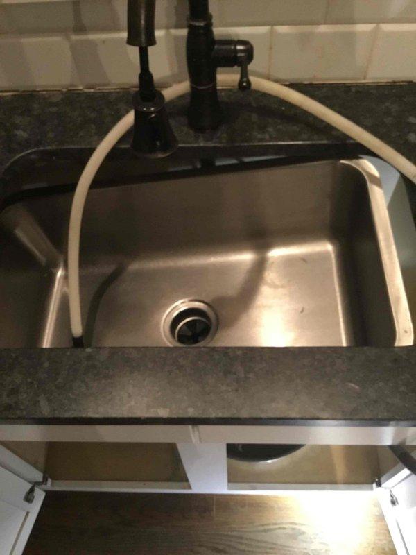 Responded to emergency call for kitchen sink that fell through countertop during customer plunging, causing plumbing damage. Installed sink brace kit to properly secure the undermount stainless steel sink to the granite countertop. Verified proper alignment of drain components and garbage disposal connection, ensuring system integrity and functionality. Responded to emergency call for kitchen sink that fell through countertop during customer plunging, causing plumbing damage. Installed sink brace kit to properly secure the undermount stainless steel sink to the granite countertop. Verified proper alignment of drain components and garbage disposal connection, ensuring system integrity and functionality.